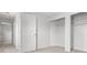 Well-lit bedroom with closet organizers, carpet flooring, and fresh paint at 8603 Barberry Pl, Parker, CO 80134