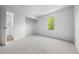Bright bedroom with neutral carpet, a window, and closet shelving at 8603 Barberry Pl, Parker, CO 80134