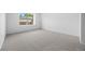 Neutral bedroom with carpeted floor and large window at 8603 Barberry Pl, Parker, CO 80134
