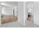 Open floorplan featuring hardwood floors, a view to the upstairs, and a hall bathroom at 8603 Barberry Pl, Parker, CO 80134