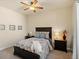 Comfortable bedroom with a ceiling fan, matching nightstands, and a tastefully patterned comforter set at 23713 E Eads Dr, Aurora, CO 80016