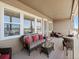 Relaxing covered patio featuring comfortable wicker furniture and views at 23713 E Eads Dr, Aurora, CO 80016