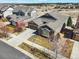 Stunning two-story home boasts stone accents, a well-manicured lawn, and a spacious driveway at 23713 E Eads Dr, Aurora, CO 80016