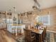 Spacious kitchen and dining area with granite countertops, stainless steel appliances, and custom wood accents at 23713 E Eads Dr, Aurora, CO 80016