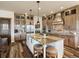 Bright, inviting kitchen with a large island, granite countertops, stainless steel appliances, and a breakfast bar at 23713 E Eads Dr, Aurora, CO 80016