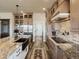 Expansive kitchen featuring granite countertops, stainless appliances, and an easy access pantry at 23713 E Eads Dr, Aurora, CO 80016