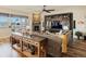 Spacious living room boasts a stone fireplace, custom built-ins with ladder, and a comfortable sectional sofa at 23713 E Eads Dr, Aurora, CO 80016