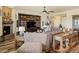 Bright living room features a stone fireplace, custom shelves, and stylish decor with lots of seating at 23713 E Eads Dr, Aurora, CO 80016
