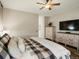 Comfortable main bedroom with a ceiling fan, stylish dressers, and modern decor at 23713 E Eads Dr, Aurora, CO 80016