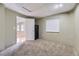 Functional basement area with neutral walls, carpet, and closet/storage solutions at 5316 S Rome St, Aurora, CO 80015