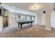 Finished basement with a pool table, neutral tones, and ample lighting for entertainment at 5316 S Rome St, Aurora, CO 80015