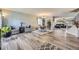 Open concept living/dining area featuring hardwood floors and stylish decor at 5316 S Rome St, Aurora, CO 80015