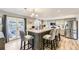 Spacious kitchen with large island, seating, stainless steel appliances, and modern finishes at 5316 S Rome St, Aurora, CO 80015