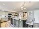 Spacious kitchen with island, granite countertops, stainless appliances, and stylish finishes at 5316 S Rome St, Aurora, CO 80015