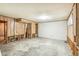 Unfinished basement space with wood paneling and concrete floor, ready to be customized at 3685 W Union Ave, Denver, CO 80236