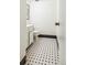 Bathroom features black-and-white tile floors and a pedestal sink and toilet at 3685 W Union Ave, Denver, CO 80236