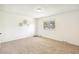 Bedroom featuring neutral walls, carpeted floors, and a large window with a wooded view at 3685 W Union Ave, Denver, CO 80236