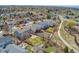 Aerial view of a suburban home featuring a spacious backyard, patio, and lush green lawn in a desirable neighborhood at 7313 W 98Th Pl, Broomfield, CO 80021