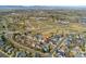 A scenic aerial view showcases a charming residential neighborhood with tree-lined streets and a well-connected community layout at 7313 W 98Th Pl, Broomfield, CO 80021