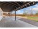Covered patio features concrete pad and access to fenced backyard at 7313 W 98Th Pl, Broomfield, CO 80021