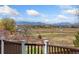 Expansive backyard view with mountain range in the distance at 7313 W 98Th Pl, Broomfield, CO 80021