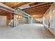 Unfinished basement with exposed ceiling beams and concrete floor at 7313 W 98Th Pl, Broomfield, CO 80021