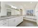 Bright bathroom featuring a double vanity, bathtub, and a window at 7313 W 98Th Pl, Broomfield, CO 80021