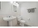 This half bathroom features tile flooring and modern fixtures at 7313 W 98Th Pl, Broomfield, CO 80021