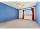 Bright bedroom with natural light and blue accent wall at 7313 W 98Th Pl, Broomfield, CO 80021