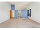 Neutral bedroom features a blue accent wall, window, and carpet at 7313 W 98Th Pl, Broomfield, CO 80021