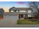 Charming two-story home featuring an attached garage and a well-maintained front yard at 7313 W 98Th Pl, Broomfield, CO 80021