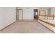 Open upper living area with white walls and wood trim at 7313 W 98Th Pl, Broomfield, CO 80021