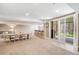 Finished basement featuring living area and shuttered doors to the outside at 5943 S Olive Cir, Centennial, CO 80111