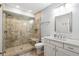 Bathroom with glass shower and white vanity at 5943 S Olive Cir, Centennial, CO 80111
