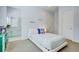 Cozy bedroom with ensuite bathroom featuring a vanity with blue cabinets at 5943 S Olive Cir, Centennial, CO 80111