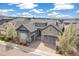 Charming single-Gathering home with a stone and stucco facade, a three-car garage, and a well-manicured yard at 5943 S Olive Cir, Centennial, CO 80111