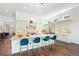 Spacious kitchen boasts an oversized island, stainless hood, and modern light fixture at 5943 S Olive Cir, Centennial, CO 80111