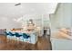 Bright kitchen features bar seating, stainless appliances, and large center island at 5943 S Olive Cir, Centennial, CO 80111