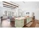Open-concept living and kitchen space features a large island and natural light at 5943 S Olive Cir, Centennial, CO 80111