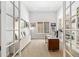 Stylish home office with ample natural light, custom built-in shelving, and modern furnishings at 5943 S Olive Cir, Centennial, CO 80111