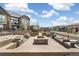 Inviting outdoor space featuring a cozy fire pit, ample seating, and well-kept landscaping at 5943 S Olive Cir, Centennial, CO 80111