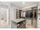 Walk-in closet with custom shelving and racks for ample storage and organization at 5943 S Olive Cir, Centennial, CO 80111