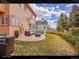 Backyard patio features comfortable seating, well maintained lawn, and privacy at 18736 E Powers Pl, Aurora, CO 80015