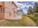 Home showcasing an outdoor patio area and lush green lawn, ideal for outdoor enjoyment and relaxation at 18736 E Powers Pl, Aurora, CO 80015