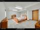 Cozy bedroom with wooden bed, storage, and neutral decor at 18736 E Powers Pl, Aurora, CO 80015