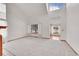 Spacious living room with tall ceilings, large windows, and neutral color palette at 18736 E Powers Pl, Aurora, CO 80015