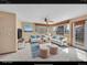 Bright living room features plush seating, area rug, and large windows at 18736 E Powers Pl, Aurora, CO 80015