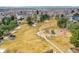 Image of a modern playground and open field with surrounding houses in the distance at 18736 E Powers Pl, Aurora, CO 80015