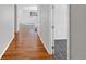 Hallway with hardwood floors leading to other rooms at 6356 Blue Water Cir, Castle Rock, CO 80108