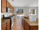 Modern kitchen with granite countertops and stainless steel appliances at 6356 Blue Water Cir, Castle Rock, CO 80108